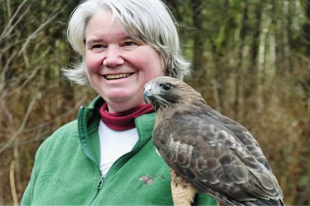 Mary Jane (Maj) Birch holding an ambassador bird