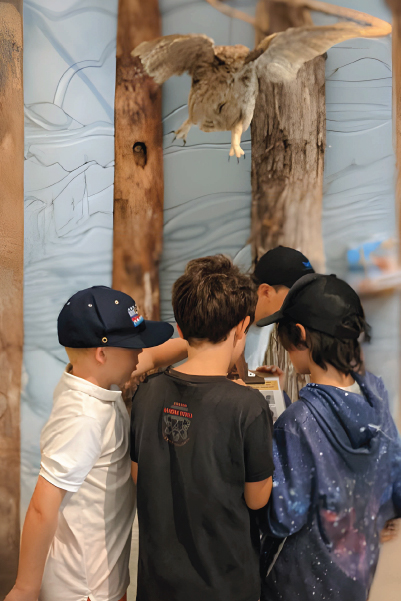a group of young students engaged in an education center activity