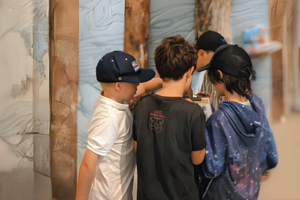 a group of young students engaged in an education center activity